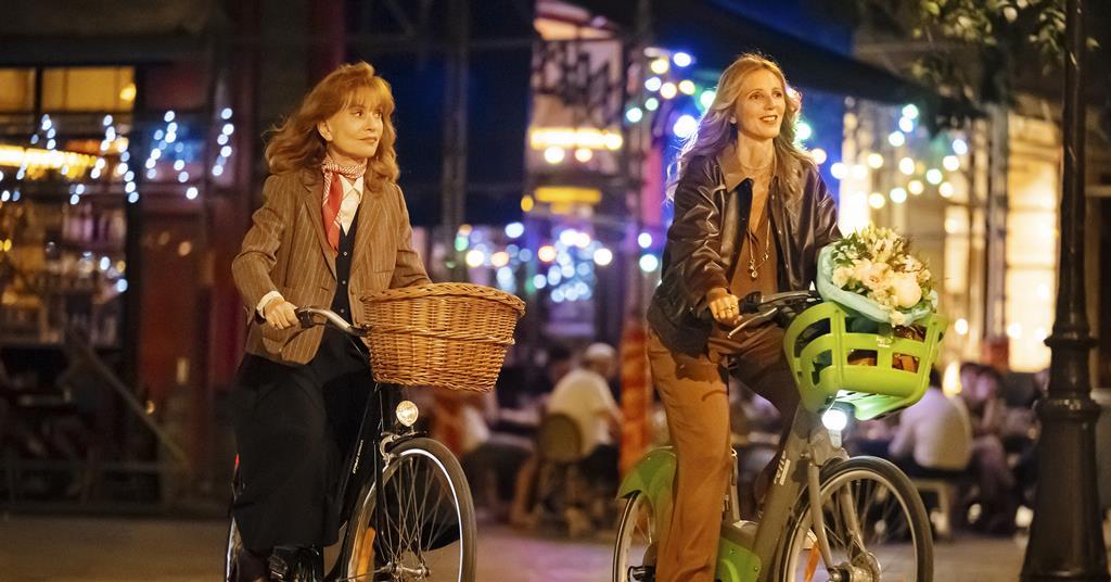 Isabelle Huppert smiling at an international film festival premiere