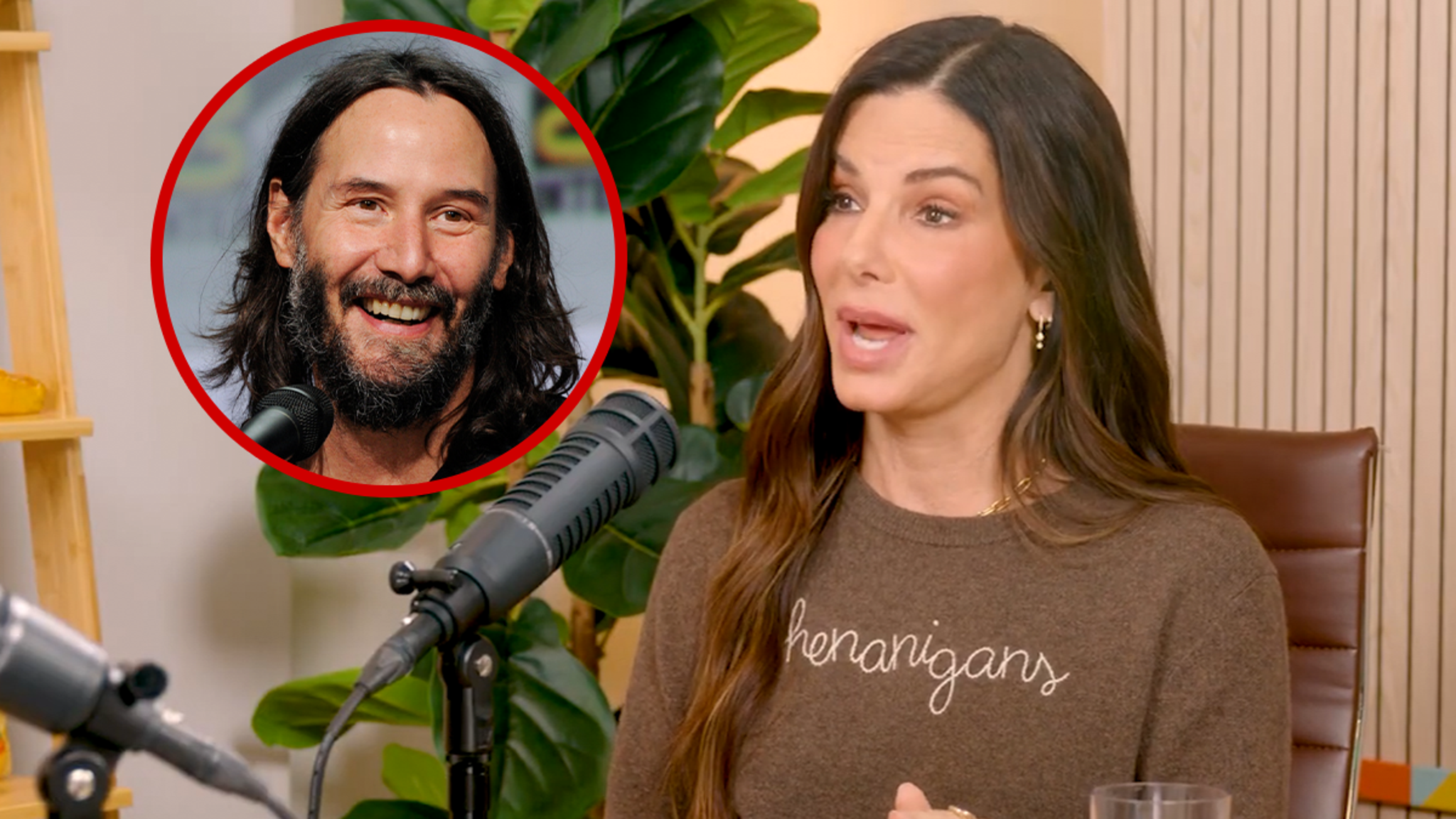 Sandra Bullock and Keanu Reeves smiling together at a Hollywood event