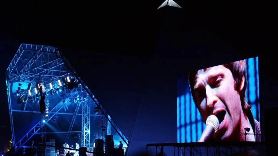 Oasis performing live on the Pyramid Stage at Glastonbury Festival 2004