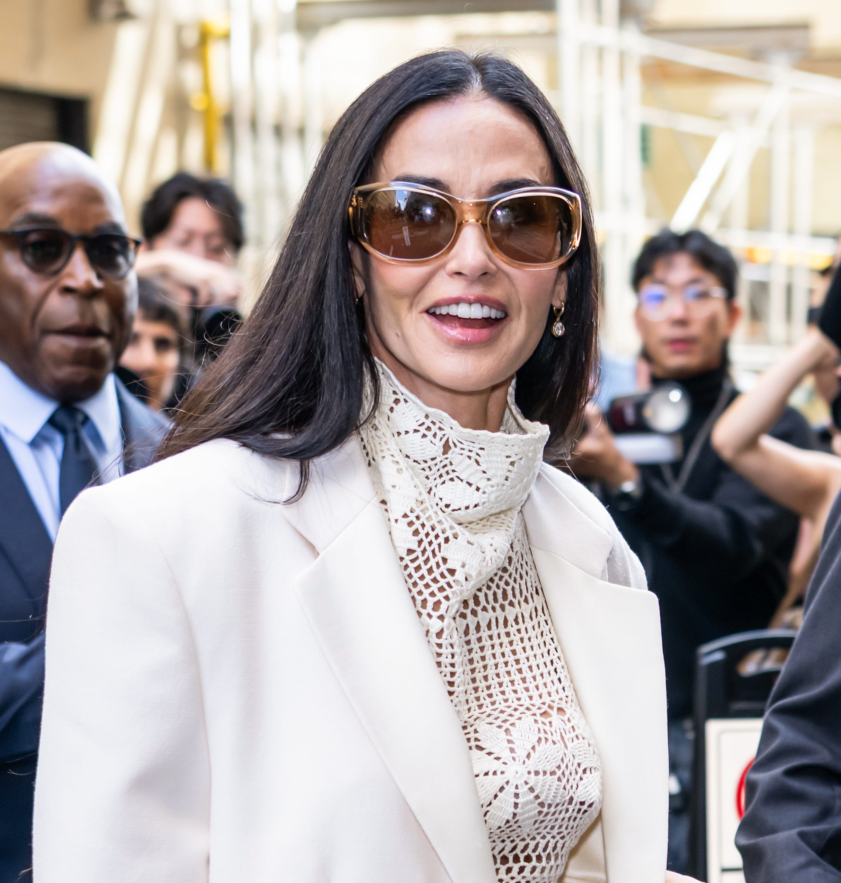 Demi Moore showing off a sleek new micro-bob haircut at a Fashion Week event.