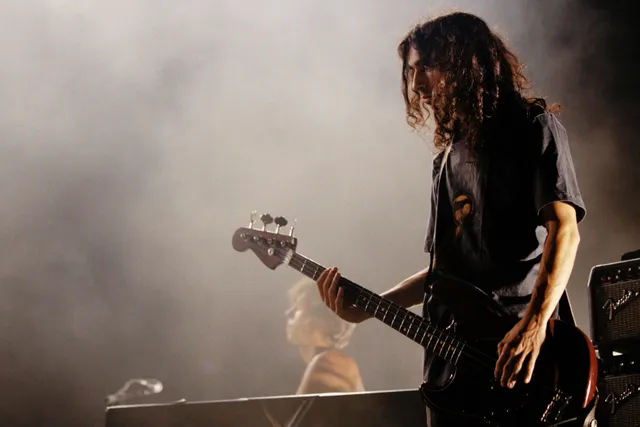 Image may contain Guitar Musical Instrument Concert Crowd Person Adult Guitarist Leisure Activities and Music