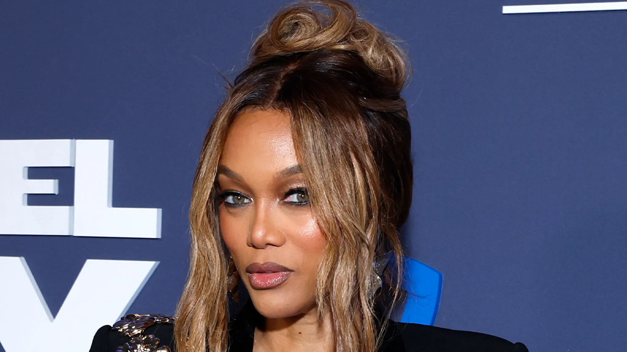 Tyra Banks posing at a red carpet event
