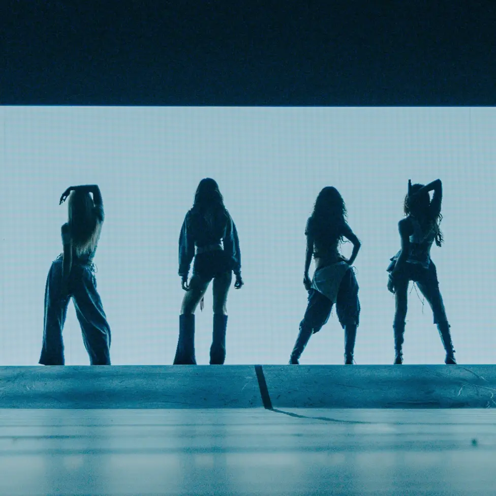 A silhouette of Katseye during a show on their Wildworld tour