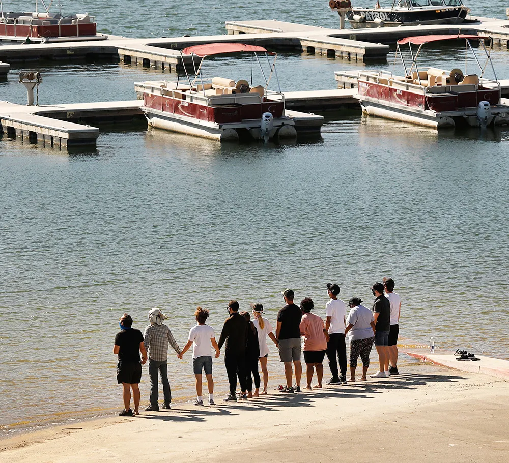 Cast members, including Heather Morris, from the TV Show "Glee" and friends held hands as they shouted "Say her name - Naya" as they gathered on the Lake Piru boat launch Monday morning just as Ventura County Sheriff's S