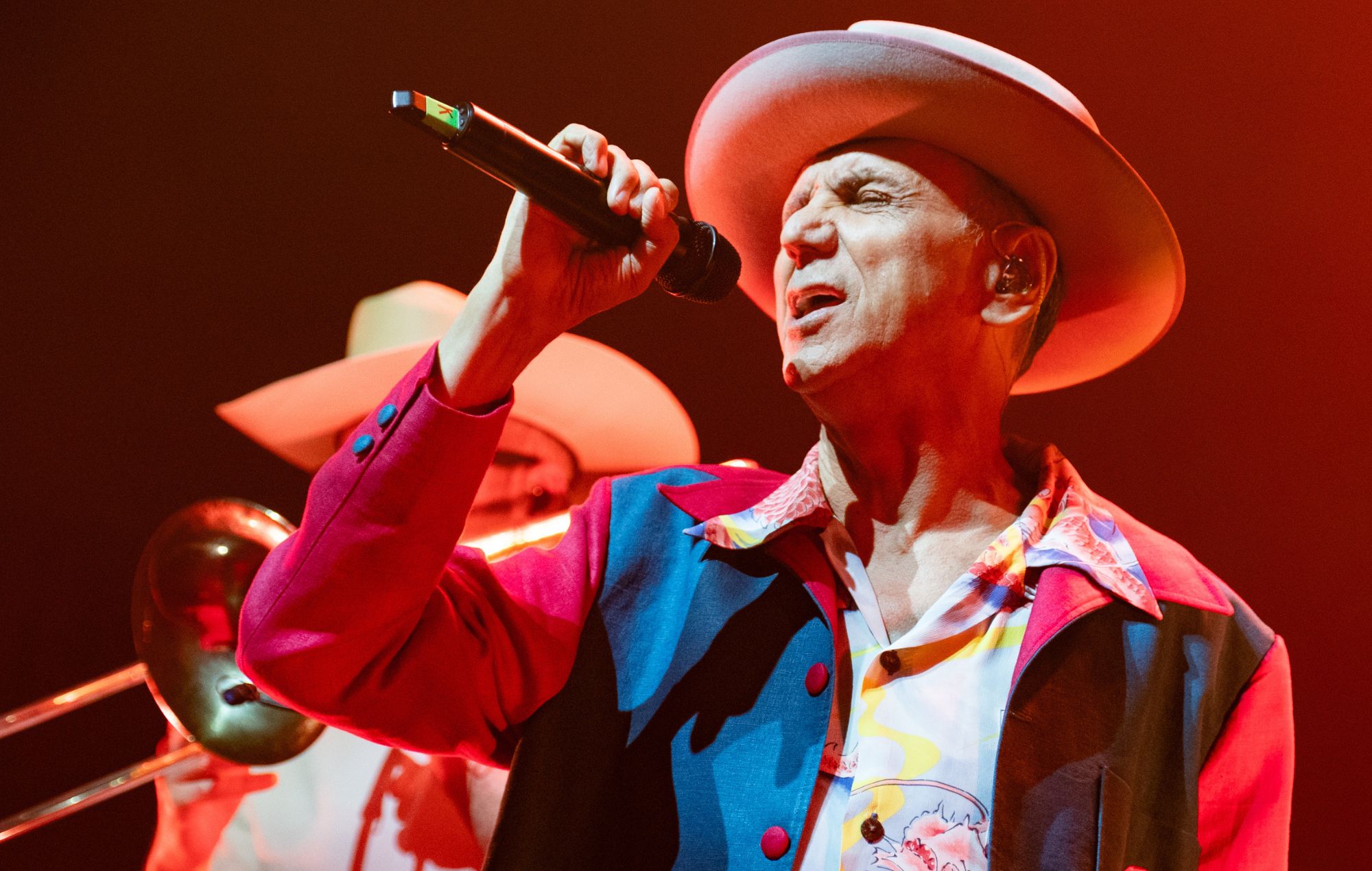 Kevin Rowland of Dexys Midnight Runners performing on stage