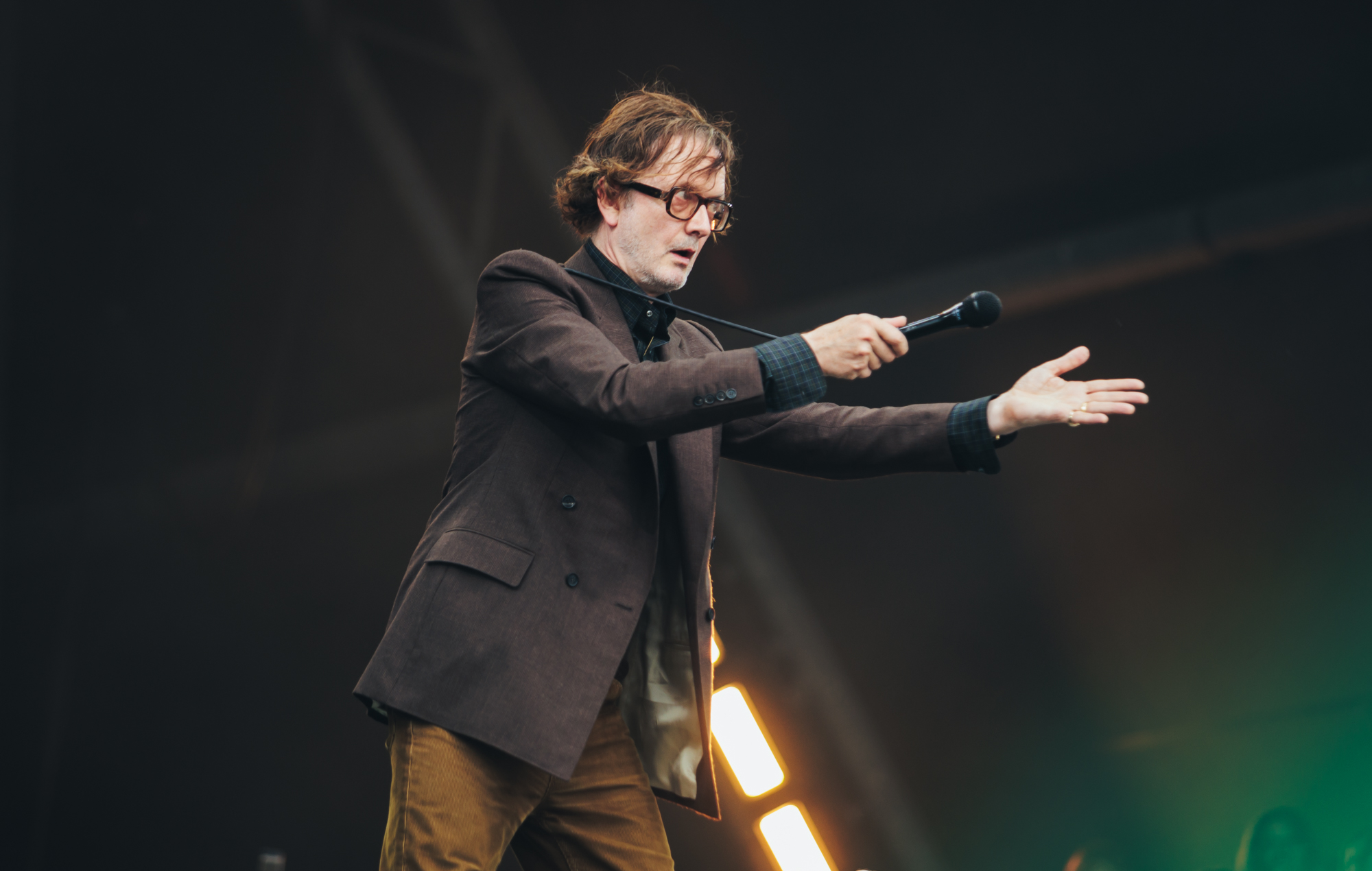 Jarvis Cocker performing live on stage with Pulp
