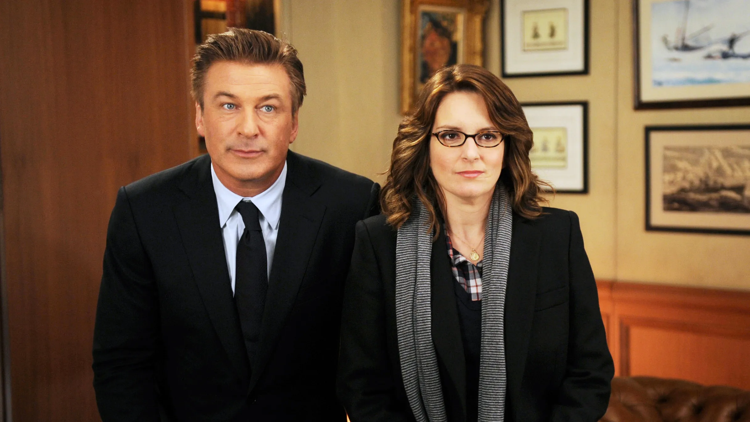 Tina Fey and Alec Baldwin pose together at a comedy industry event