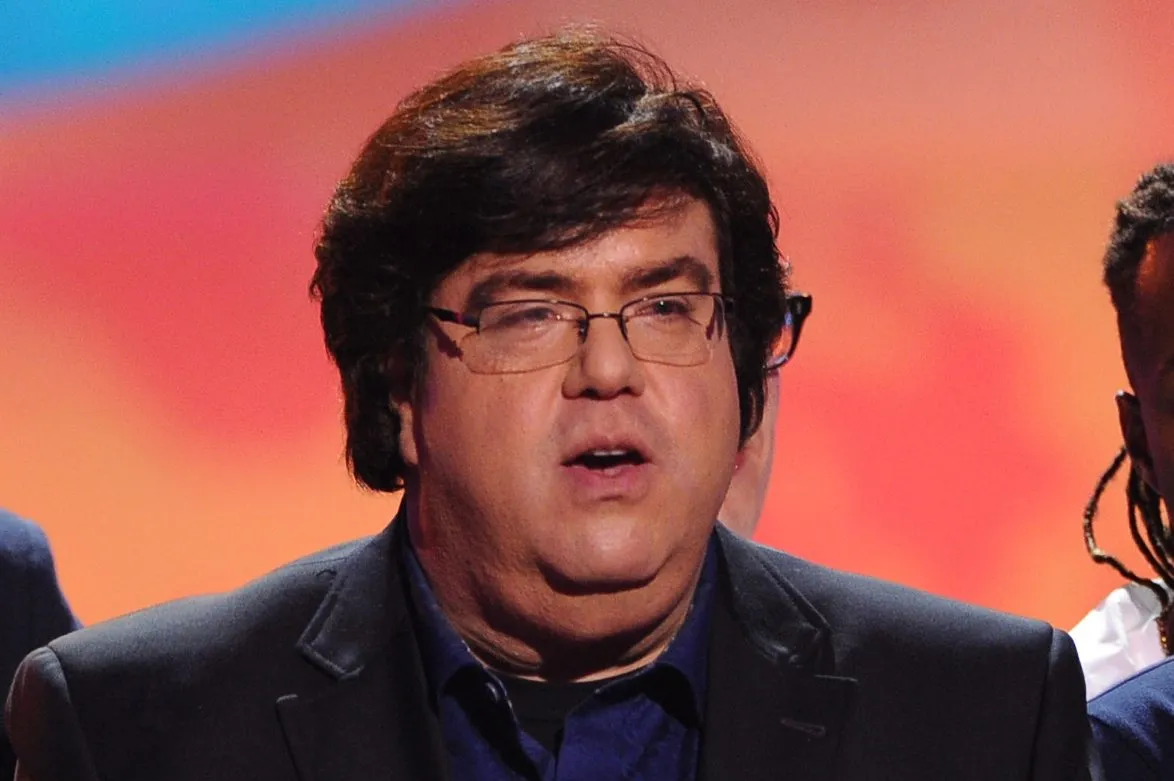 Dan Schneider posing at a television industry event