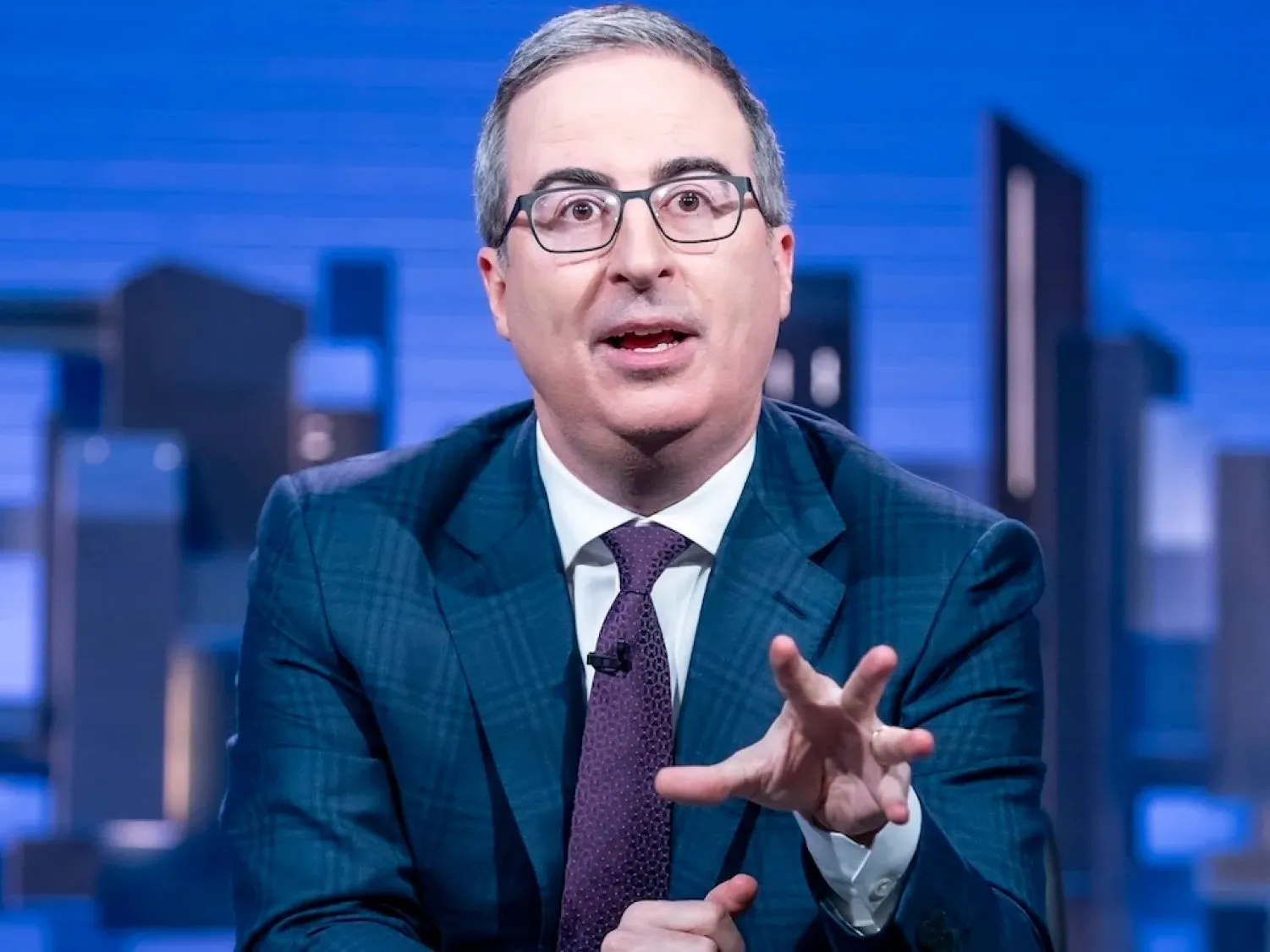 John Oliver gesturing while delivering a monologue on Last Week Tonight
