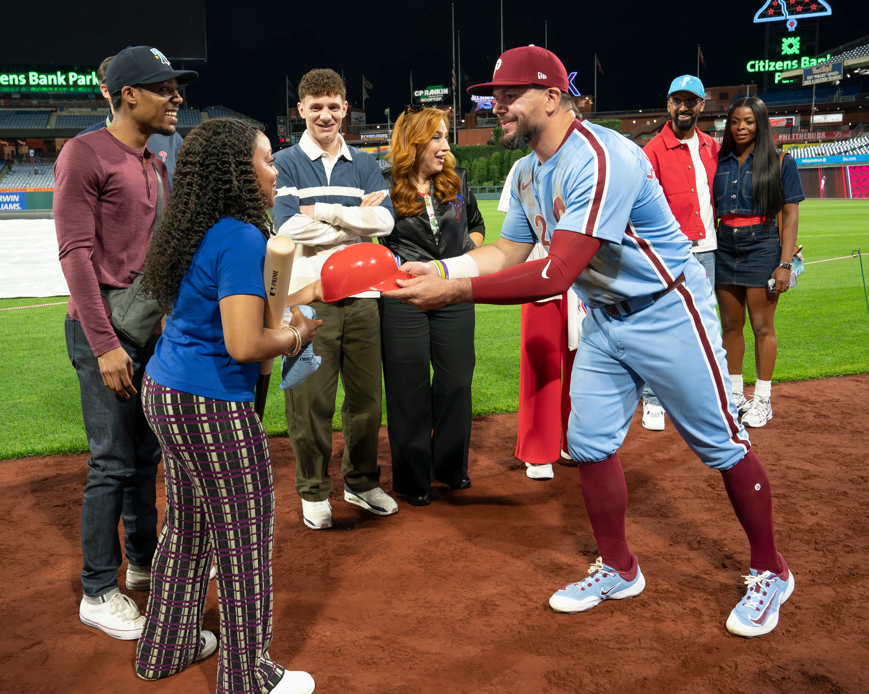 Abbott Elementary cast at a baseball game