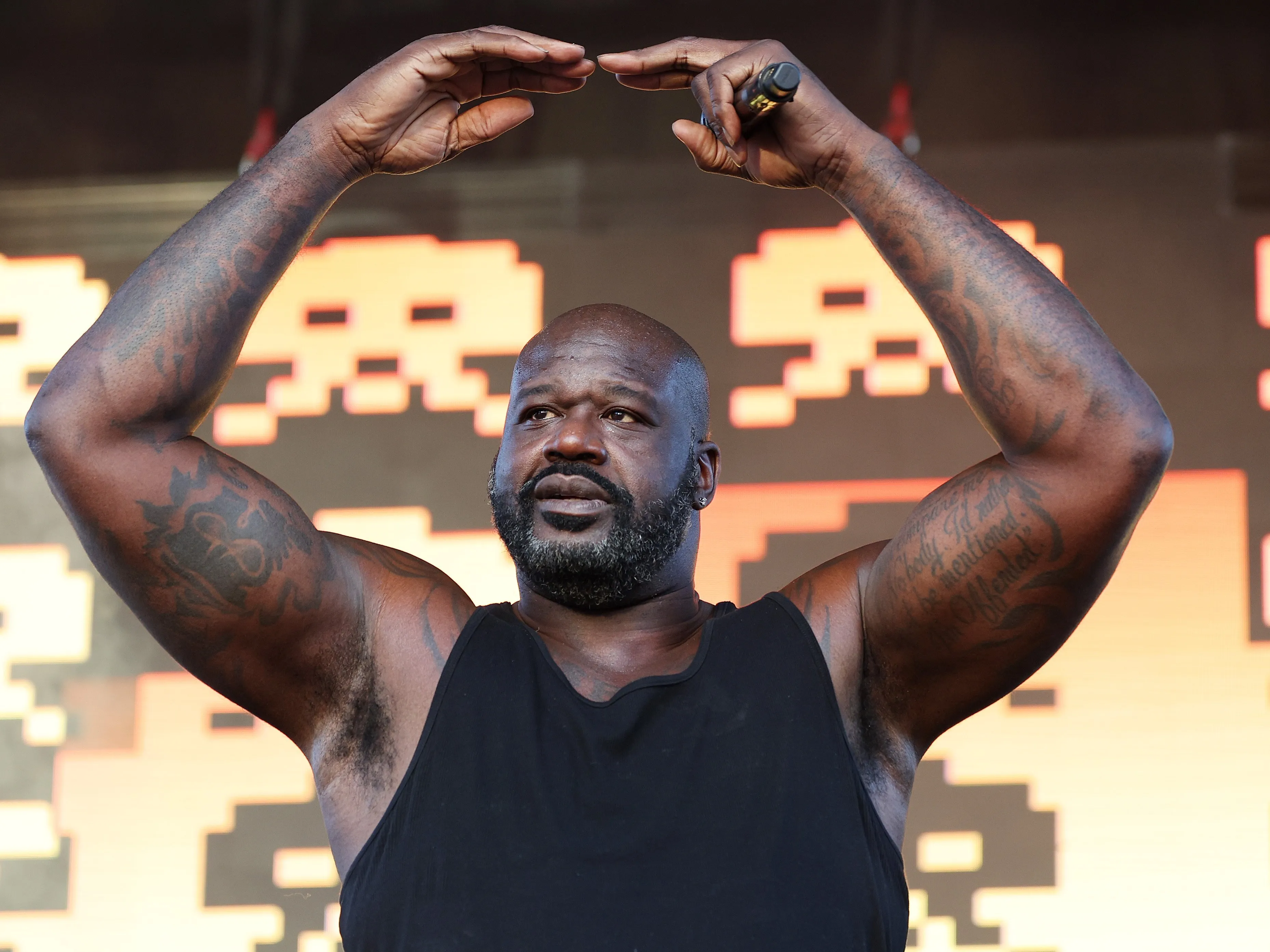 Shaquille O'Neal posing at a Hollywood red carpet event