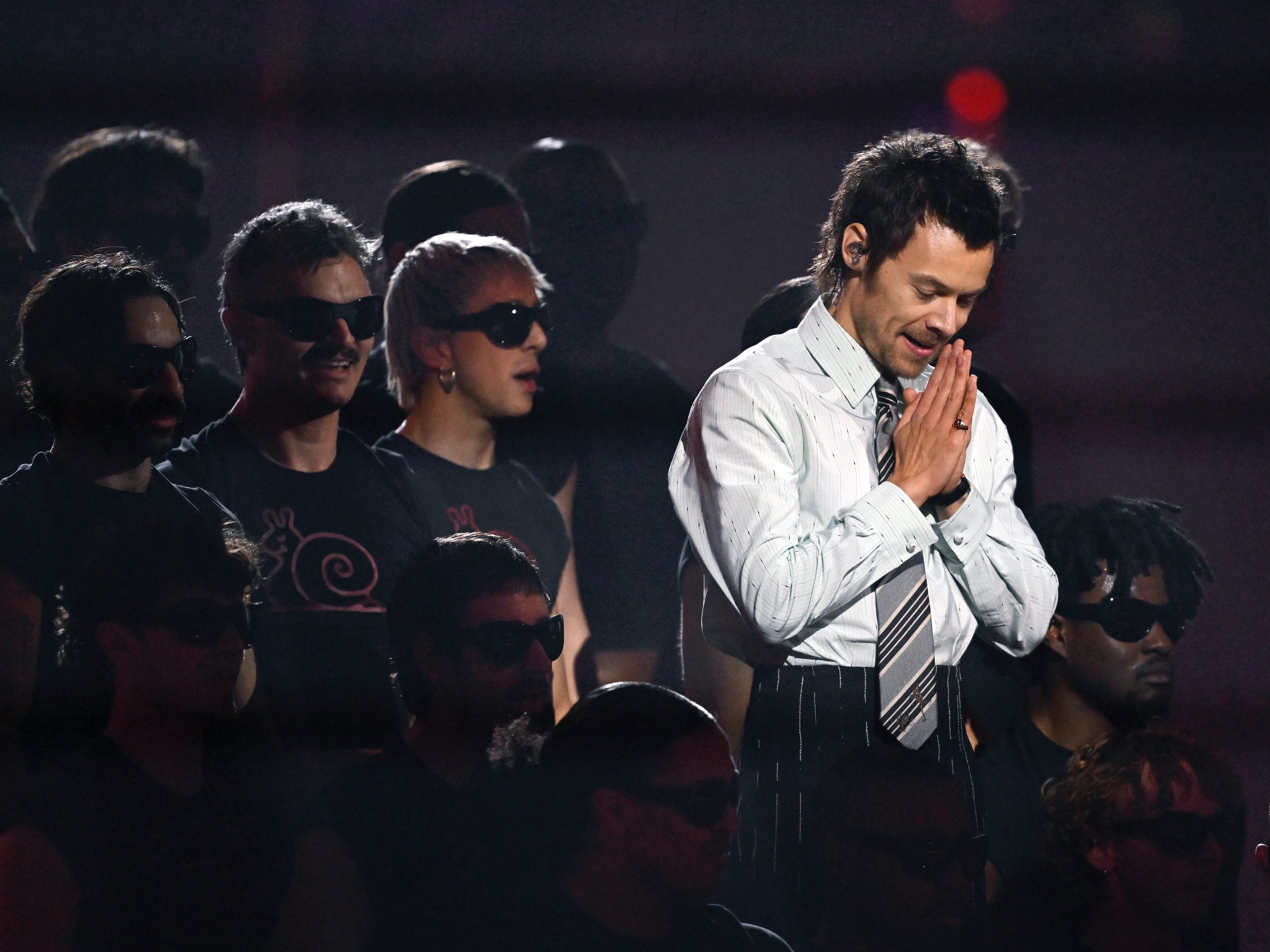 Harry Styles performing live on stage during his concert residency