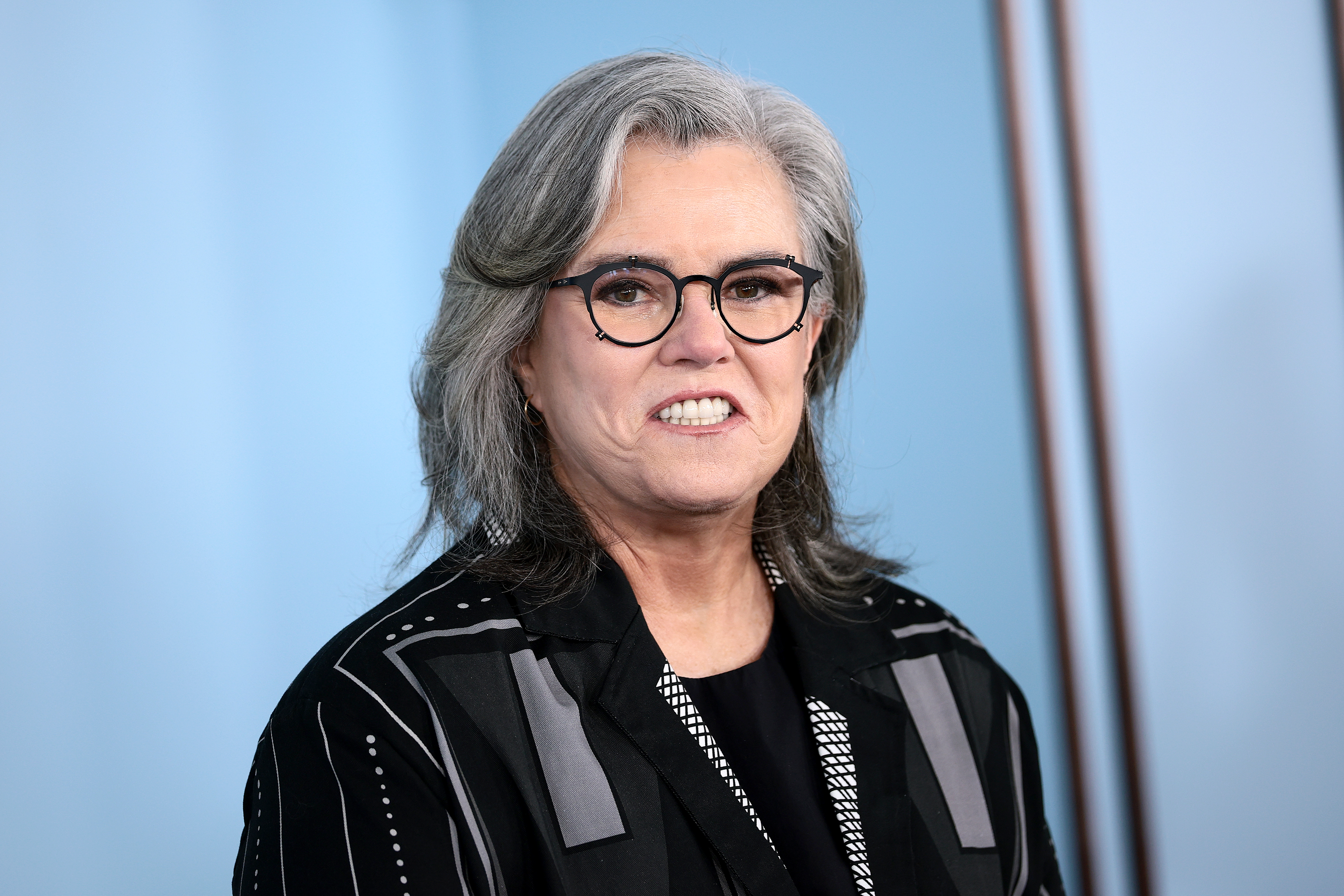 Rosie O'Donnell smiling at a public broadcast appearance
