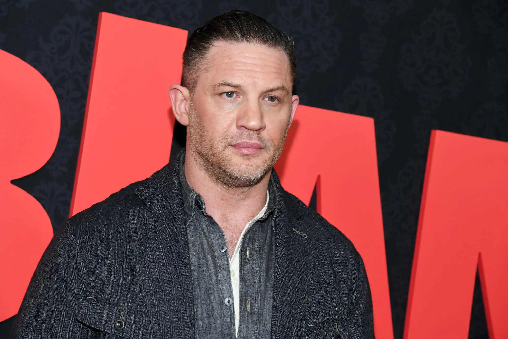 Tom Hardy performing as rap alter ego Frankie Pulitzer