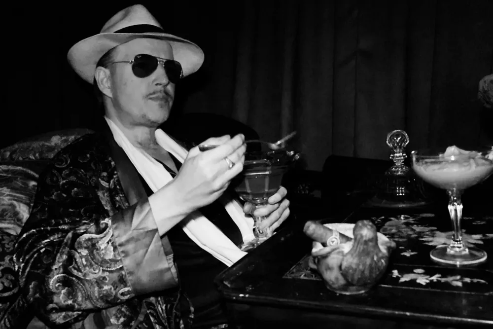 Horror movie director Tom Six posing at an event.