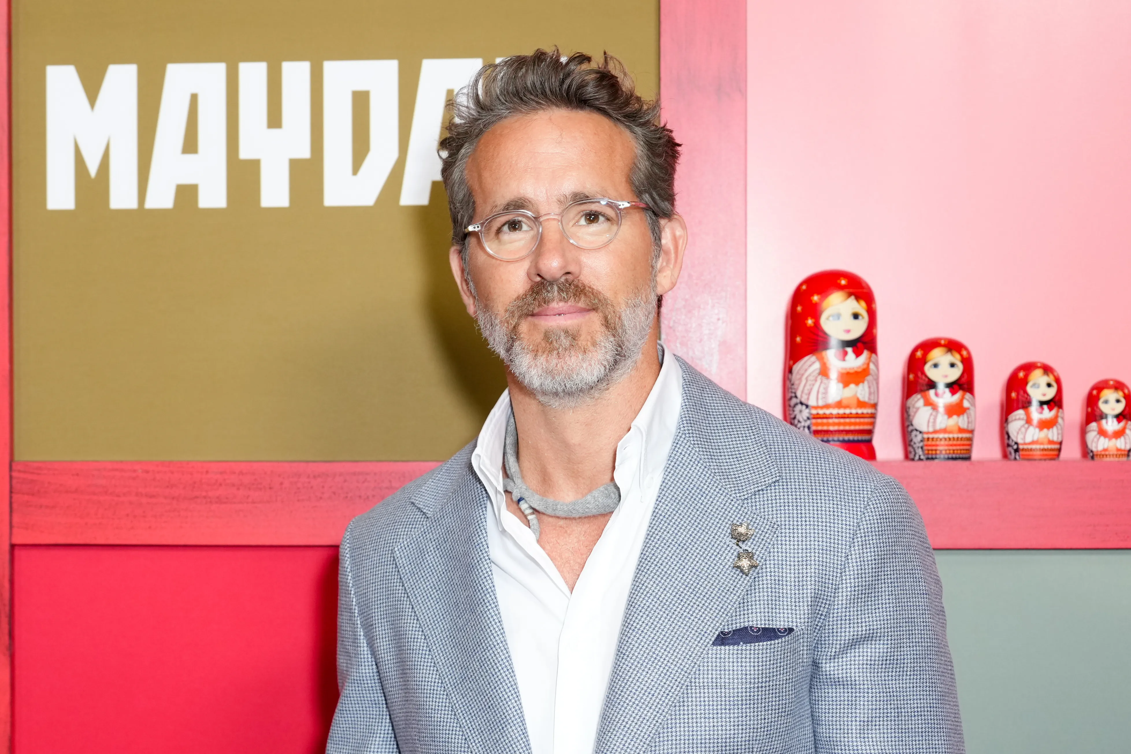 Ryan Reynolds smiling at a public appearance