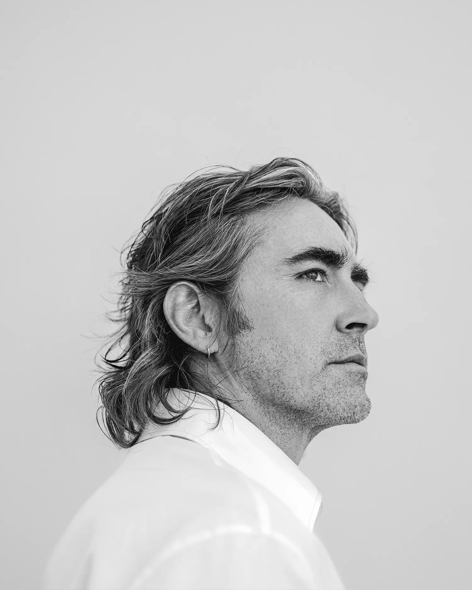 Lee Pace attending a movie premiere in a dark suit