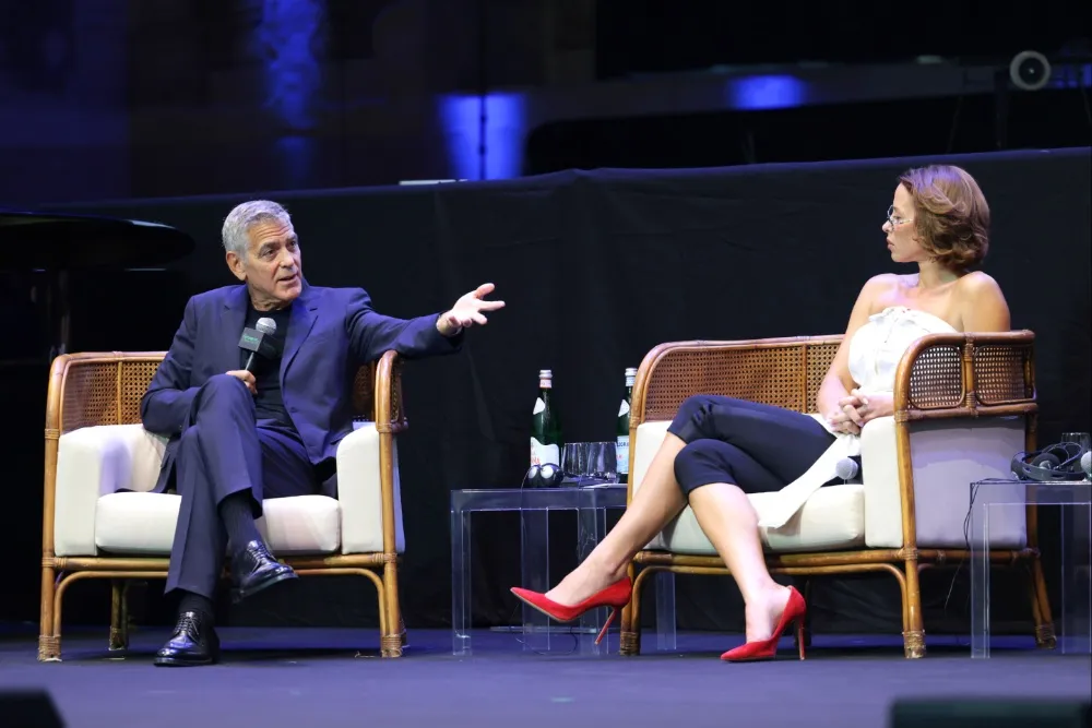 George Clooney speaking at a public event