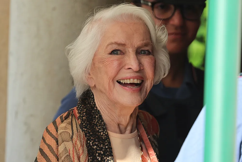 Ellen Burstyn smiling on a red carpet