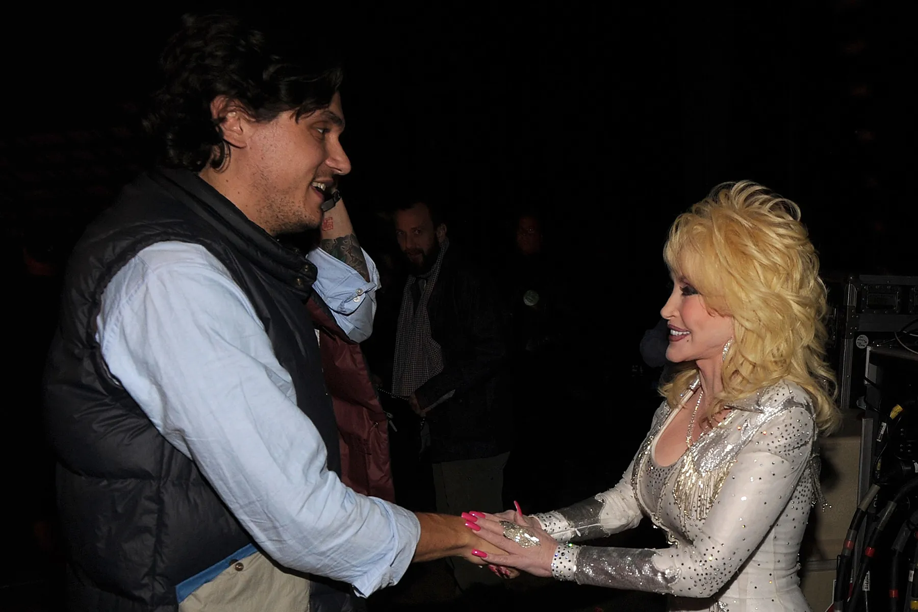 John Mayer and Dolly Parton meet backstage at the 2010 We're All For The Hall benefit concert at the Bridgestone Arena on October 5, 2010 in Nashville, Tennessee.
