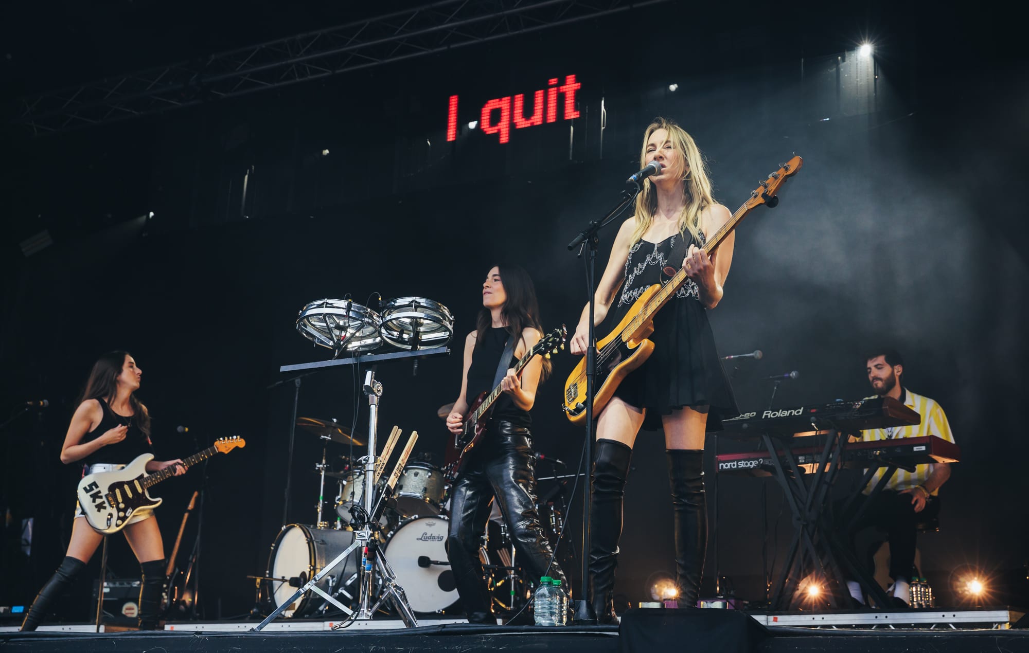 Este Haim performing live on stage with HAIM