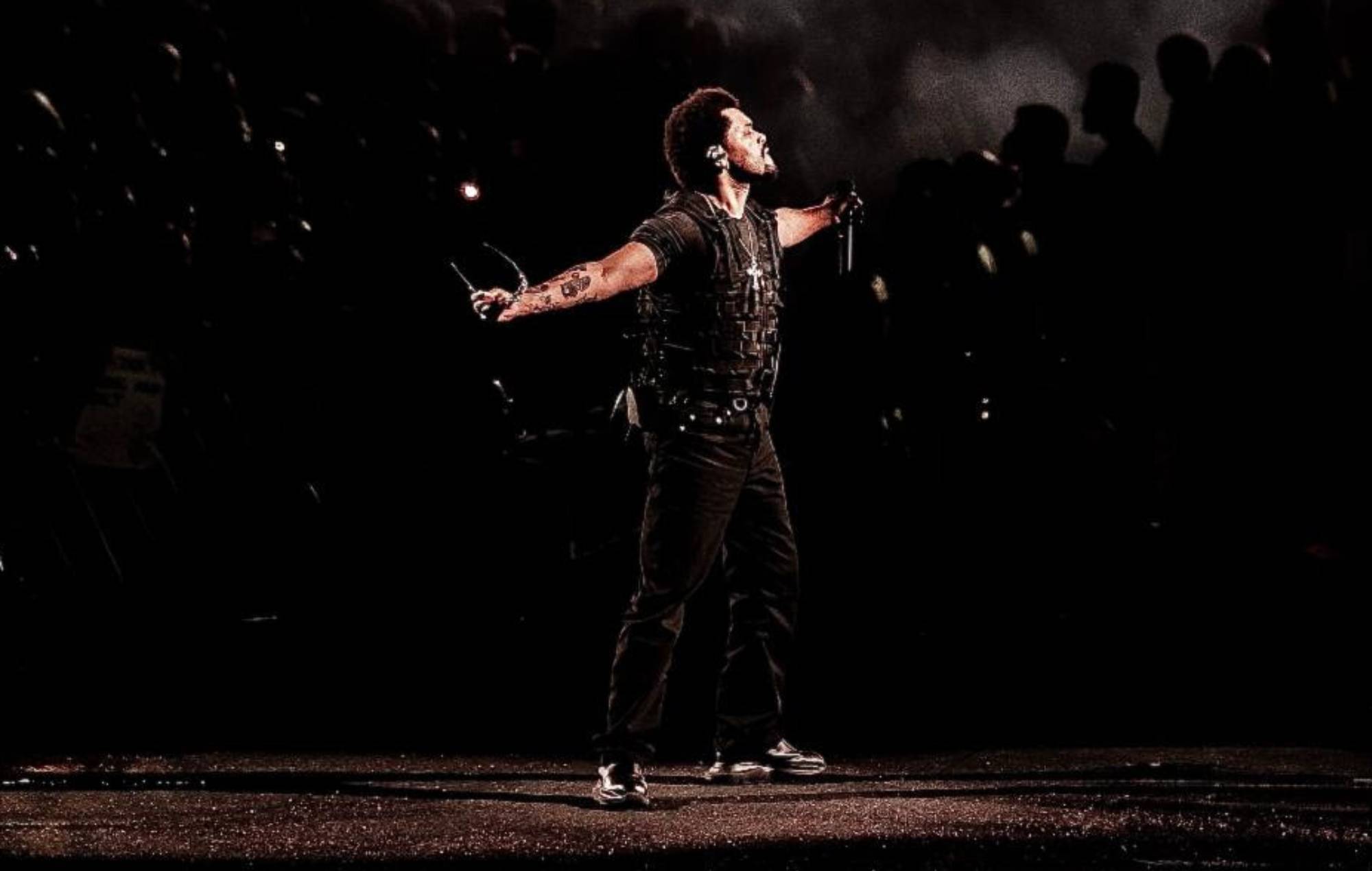 The Weeknd performing on stage during his After Hours Til Dawn stadium tour.