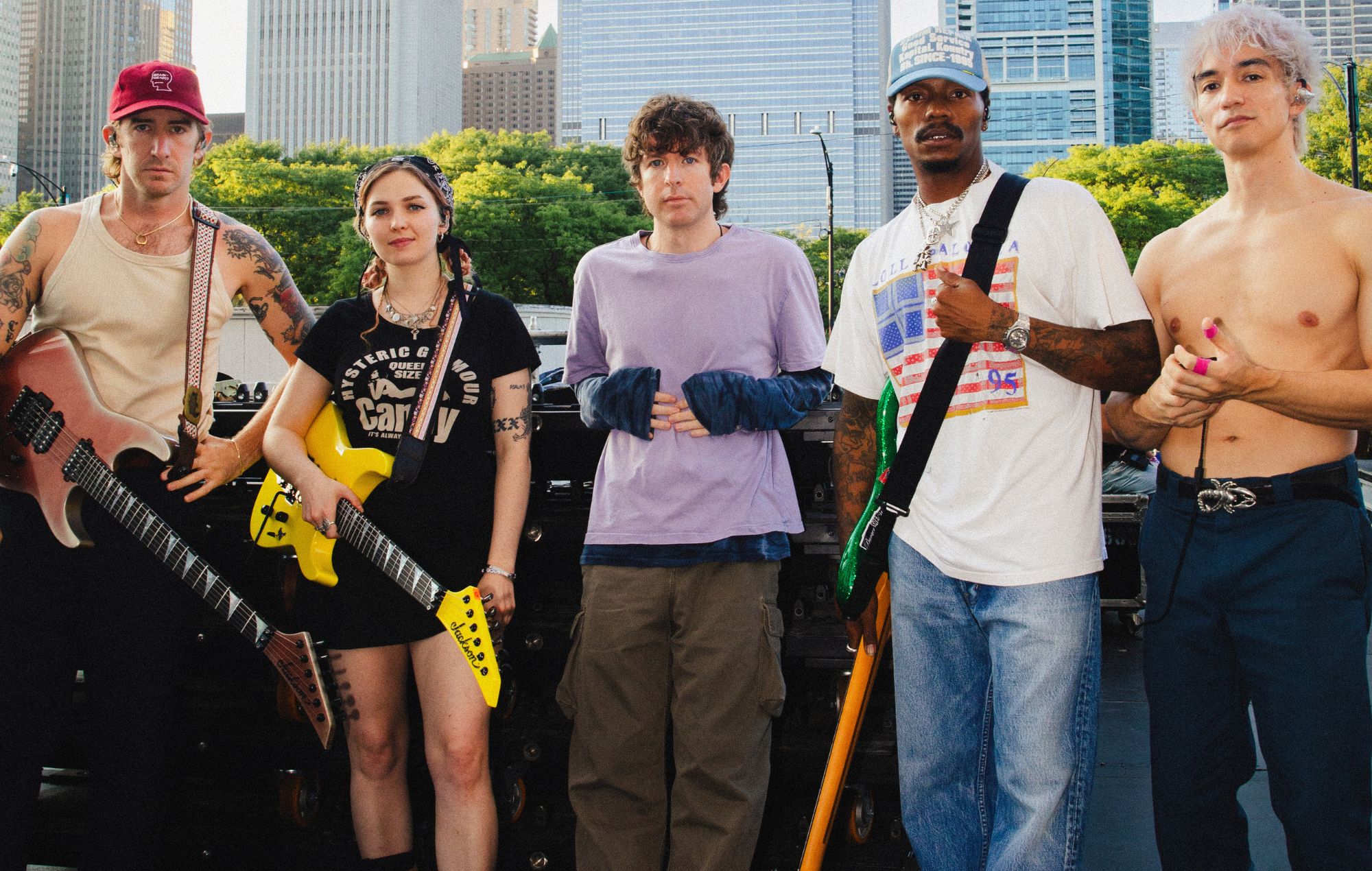 Turnstile performing live on stage in front of a festival crowd