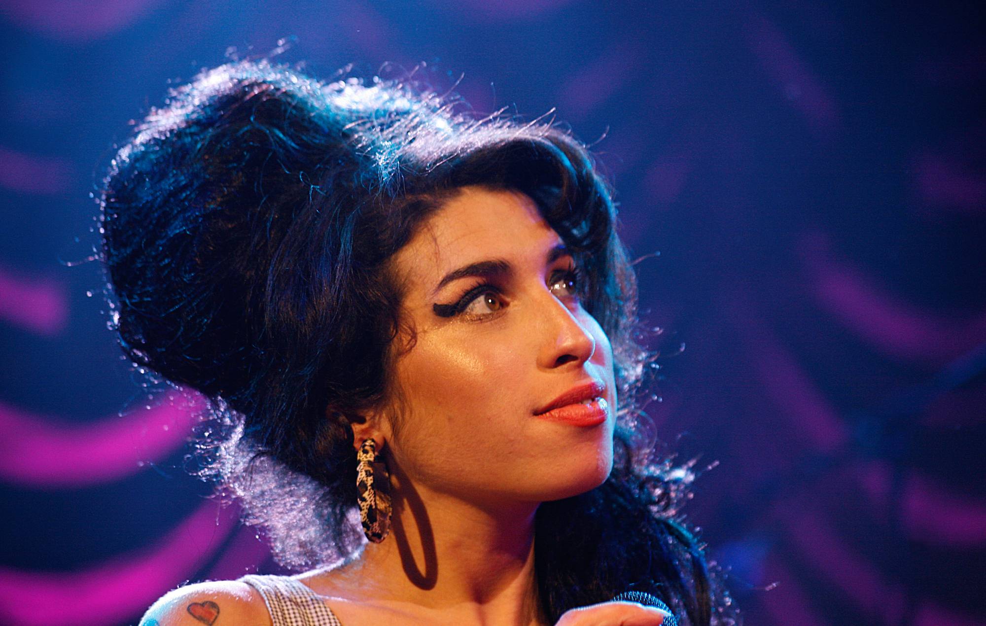 Amy Winehouse performing on stage