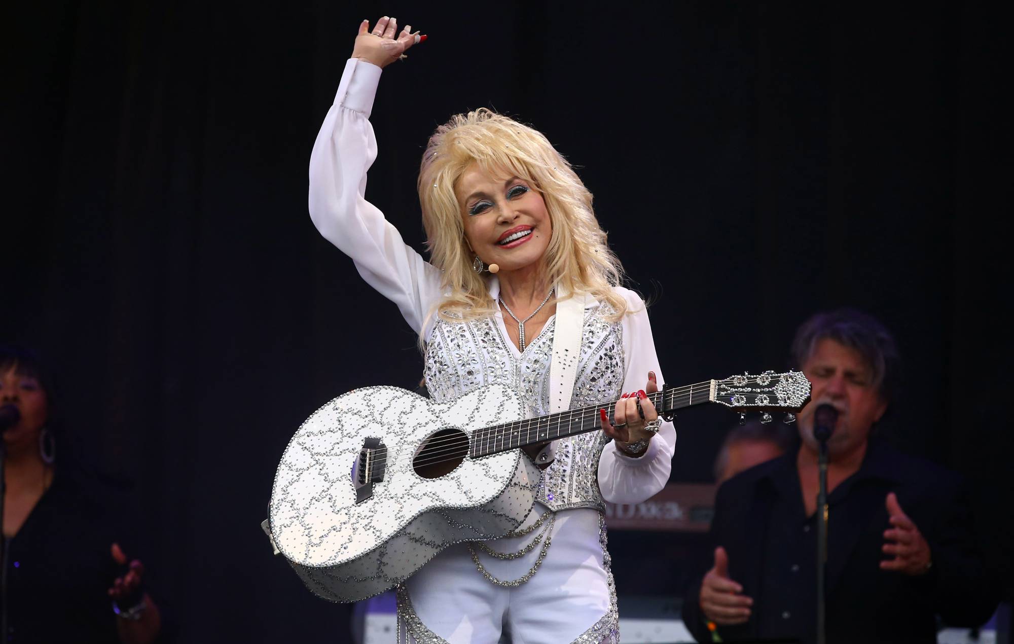 Country legend Dolly Parton performing live on stage at a festival