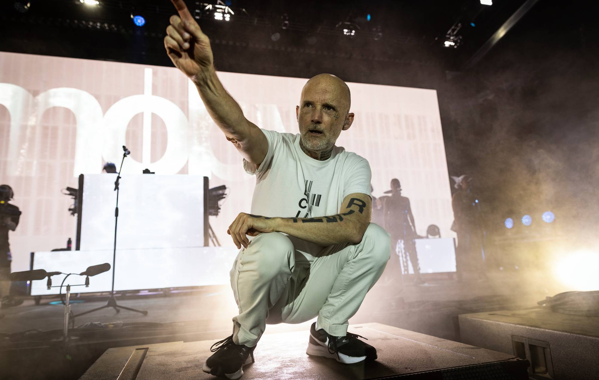 Moby performing live on stage during a concert set in Dublin