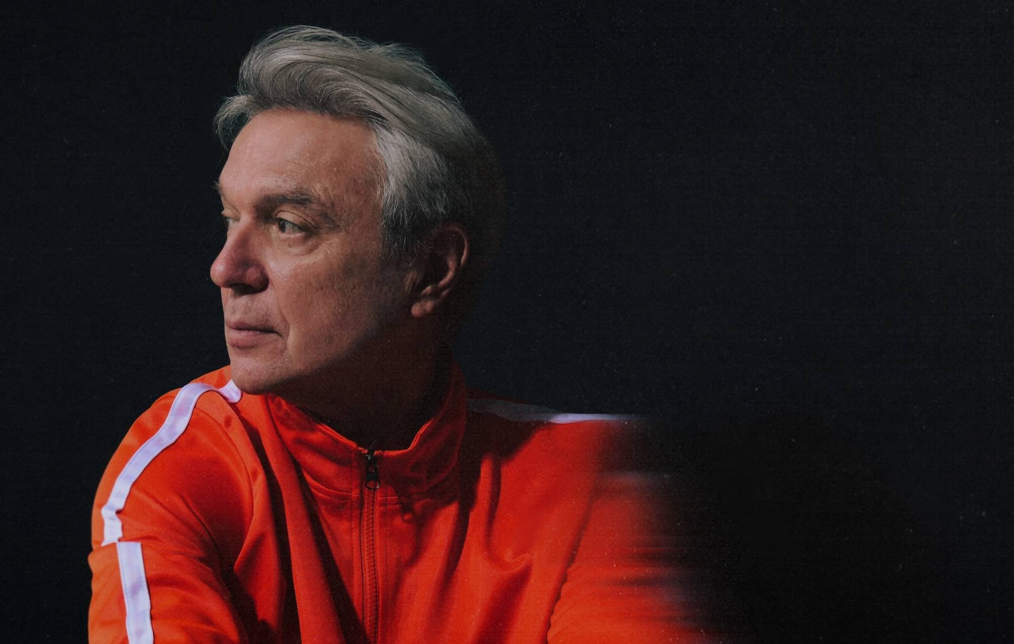 David Byrne performing live on stage