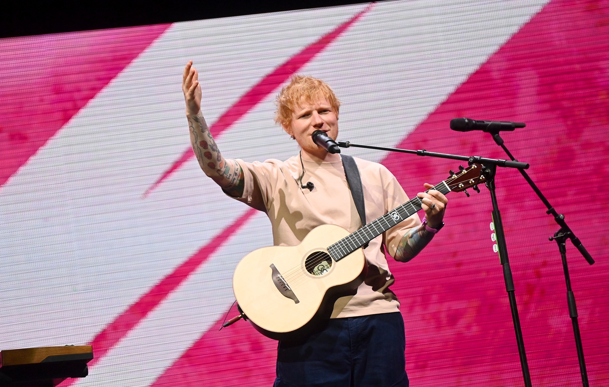 Ed Sheeran performing live on stage during a concert