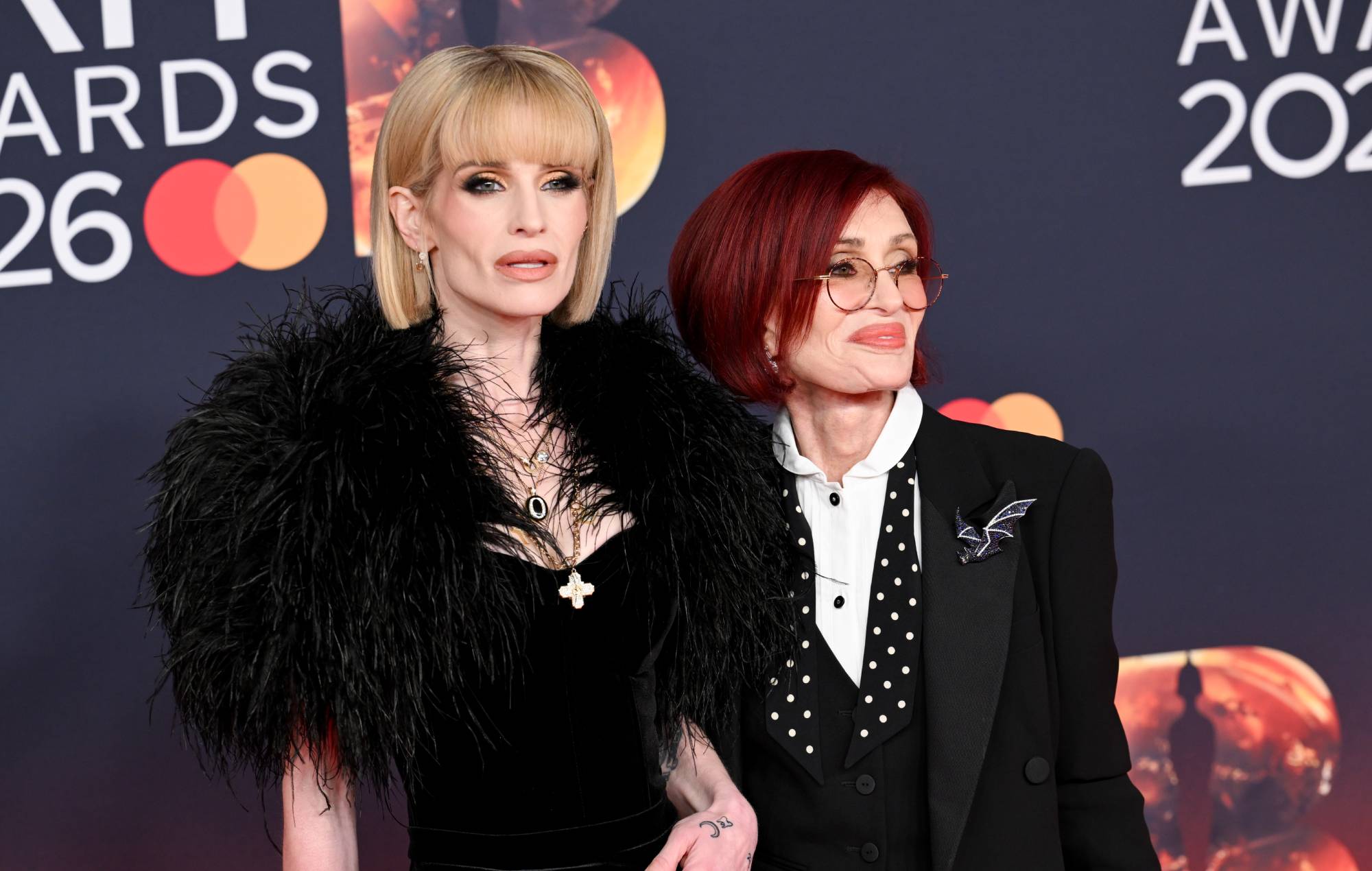 Kelly Osbourne and Sharon Osbourne on a red carpet
