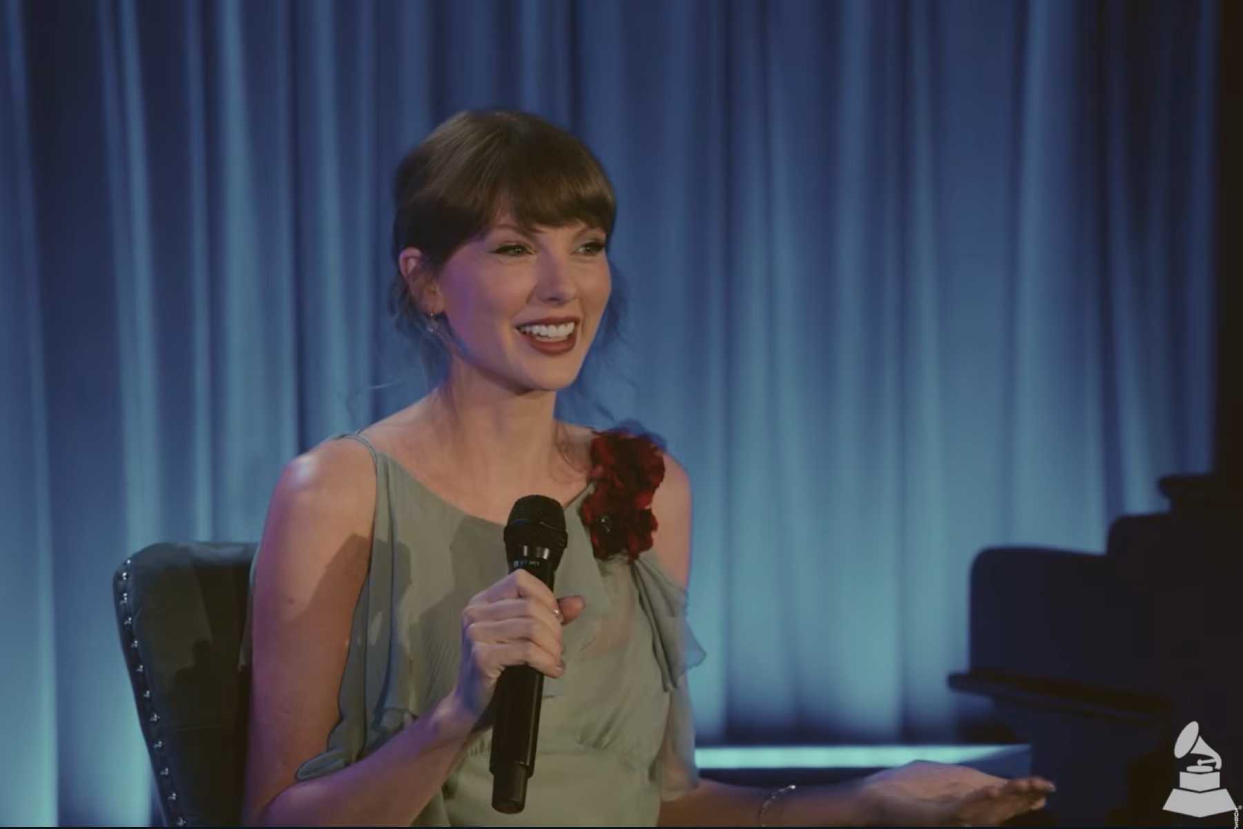 Taylor Swift smiling during a sit-down interview