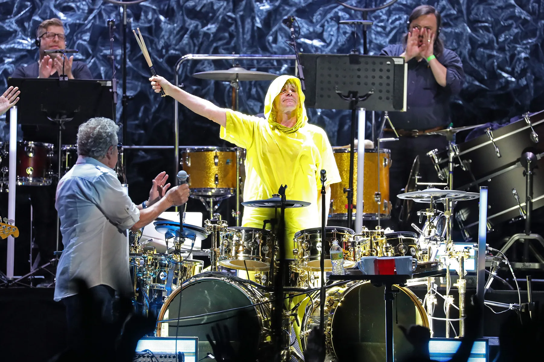 Zak Starkey performing on stage with rock band The Who