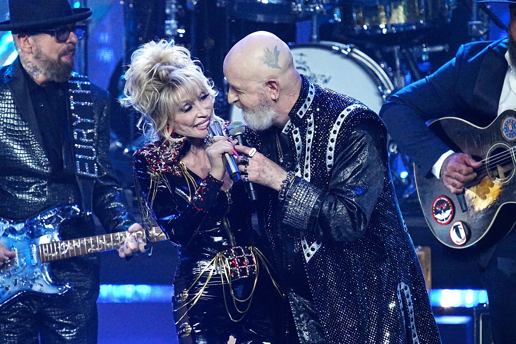 Dolly Parton performing live on stage at the Rock and Roll Hall of Fame induction ceremony