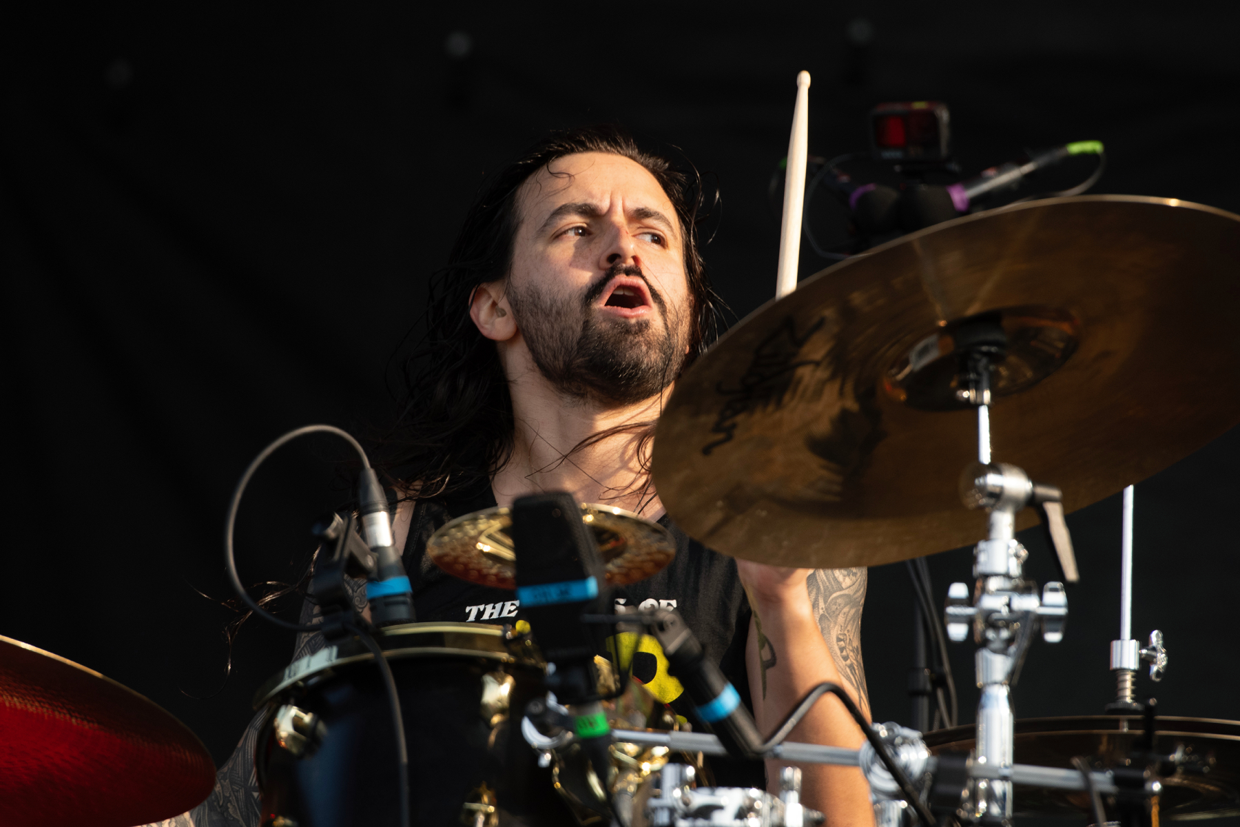 Jay Weinberg playing drums on stage during a concert