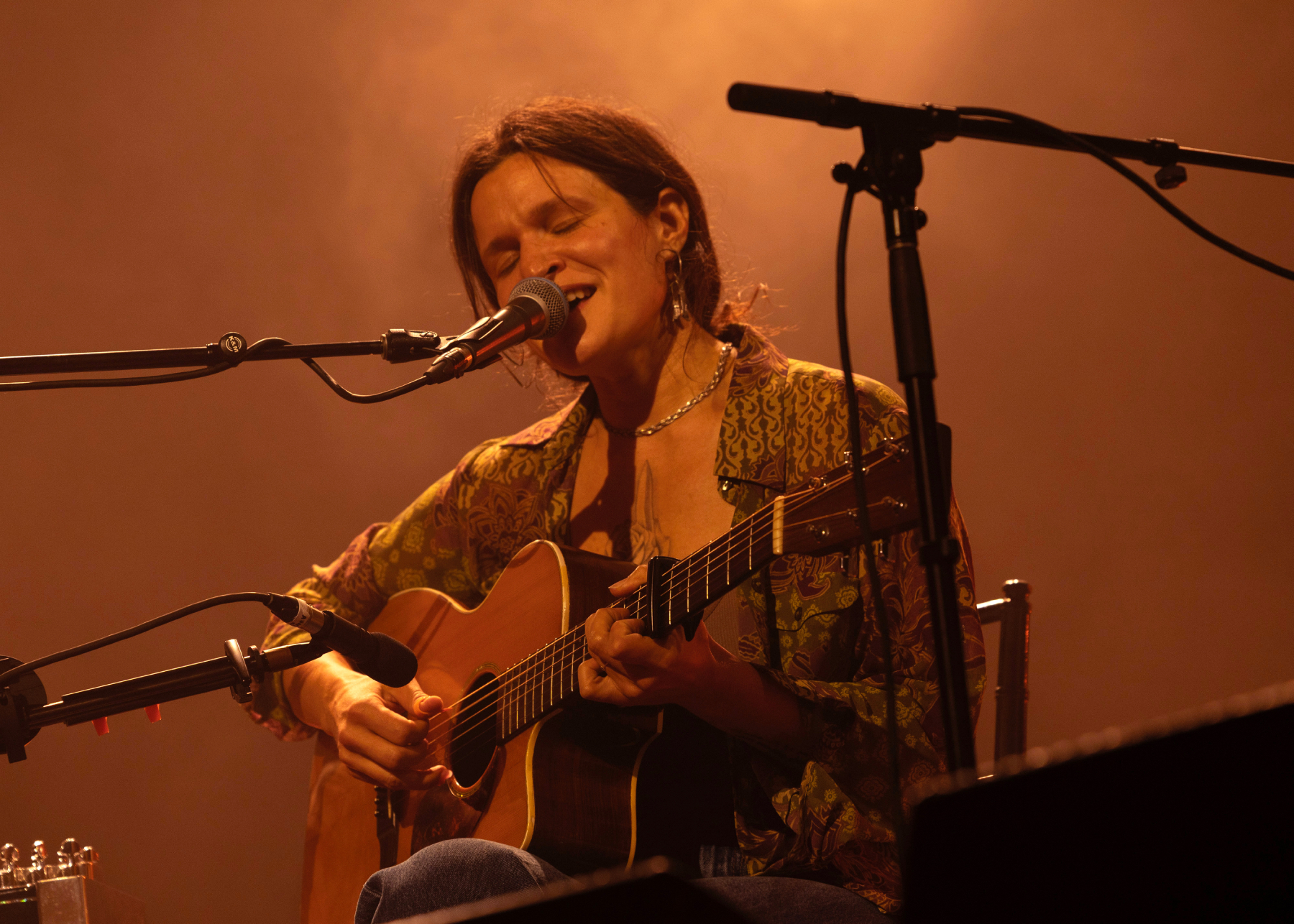 Big Thief performing live on stage at the Ryman Auditorium in Nashville