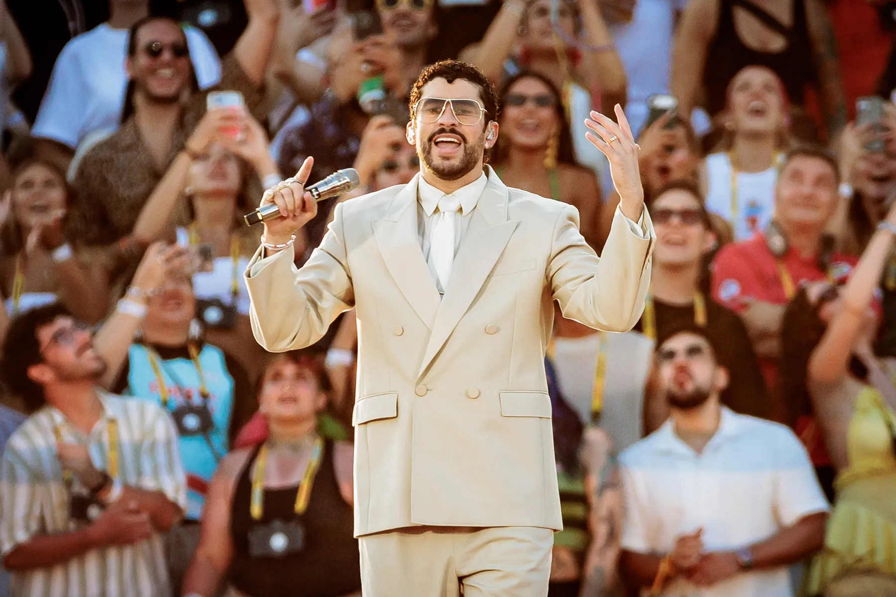 Bad Bunny performing live on stage during a concert