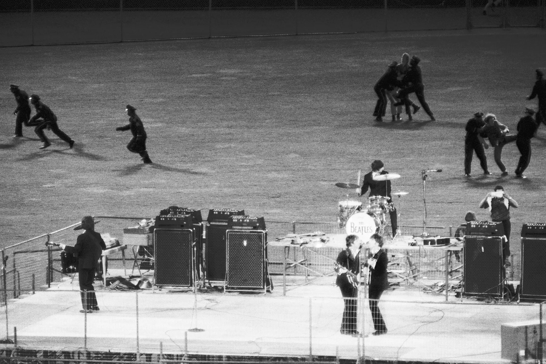 The Beatles performing on stage during their final concert tour