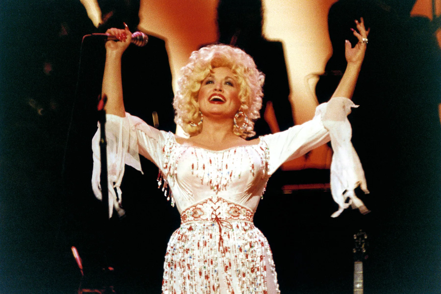 Country music icon Dolly Parton posing at a public appearance