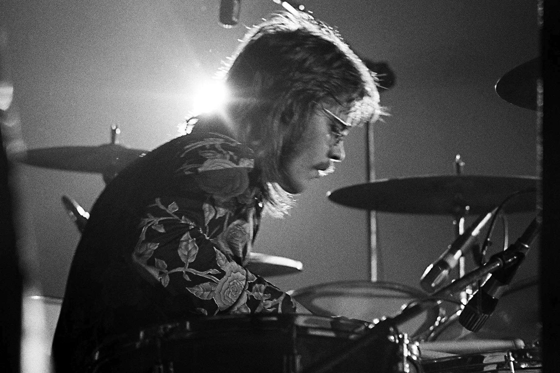 ZZ Top drummer Frank Beard seated behind his drum kit during a live concert performance