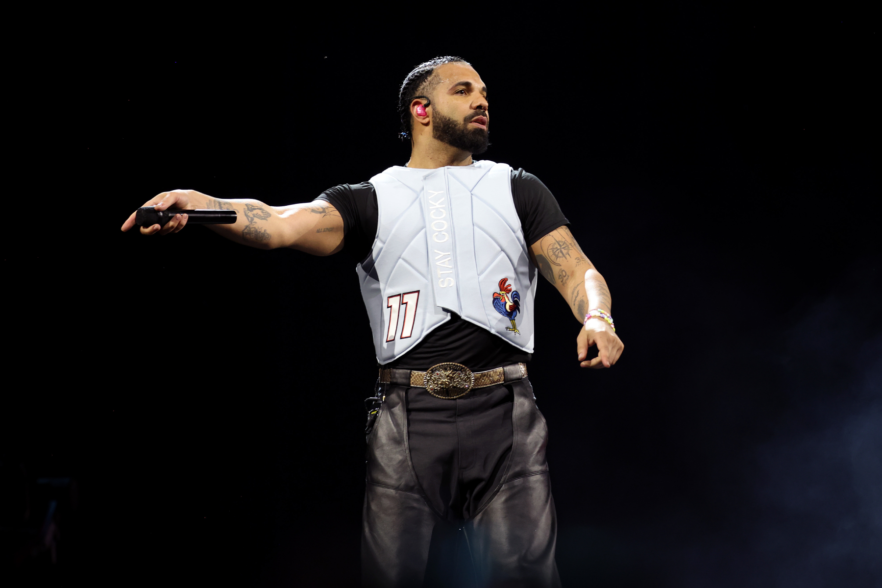 Drake performing on stage at a concert