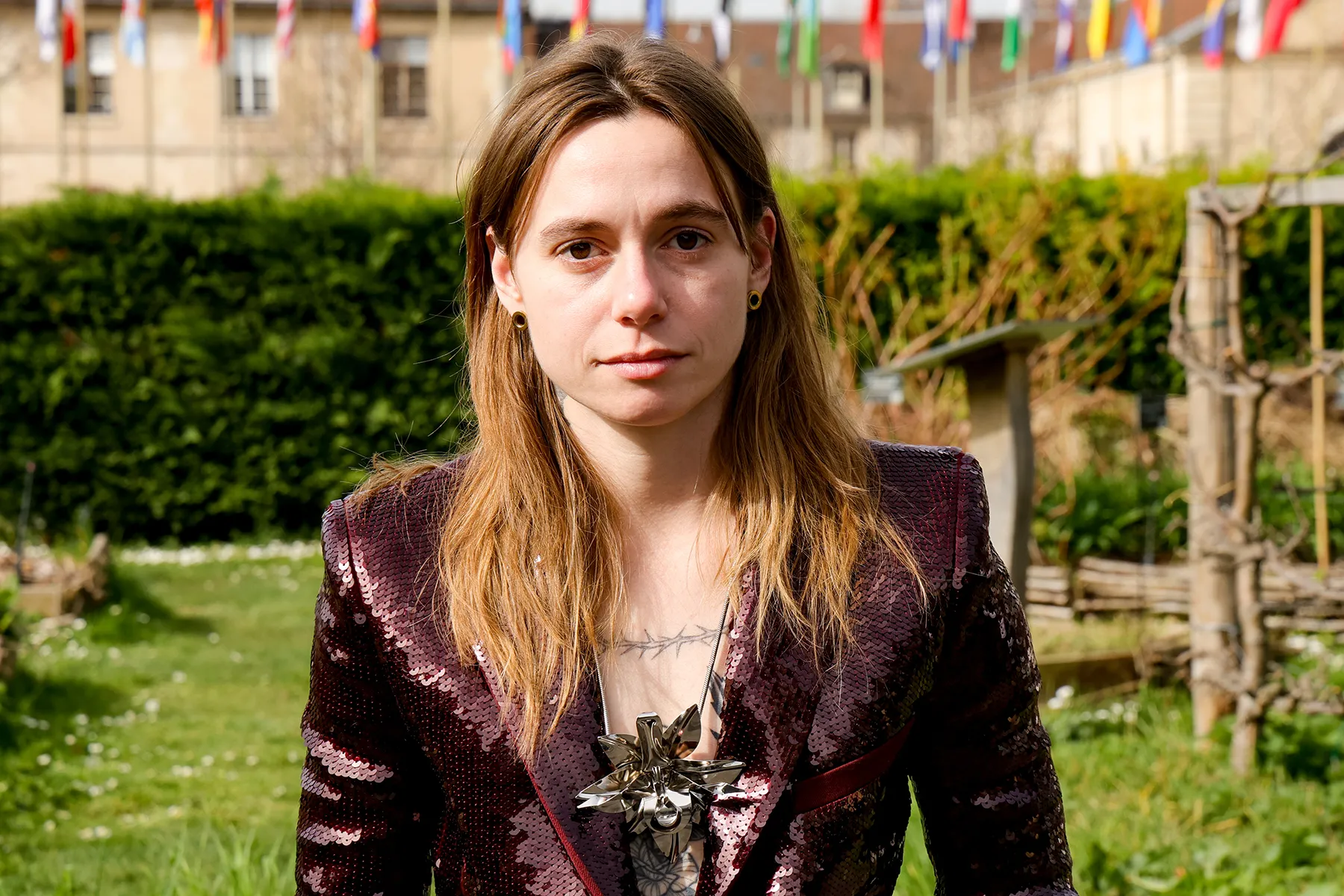 Julien Baker performing live on stage with an electric guitar