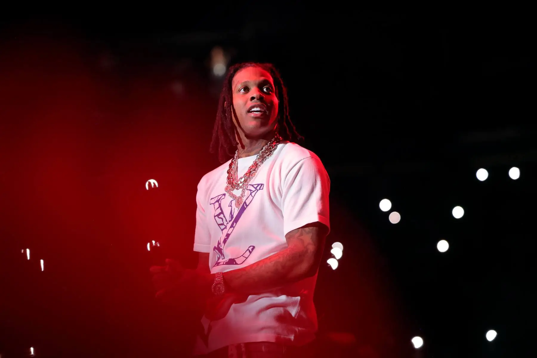 Lil Durk performing on stage during a concert