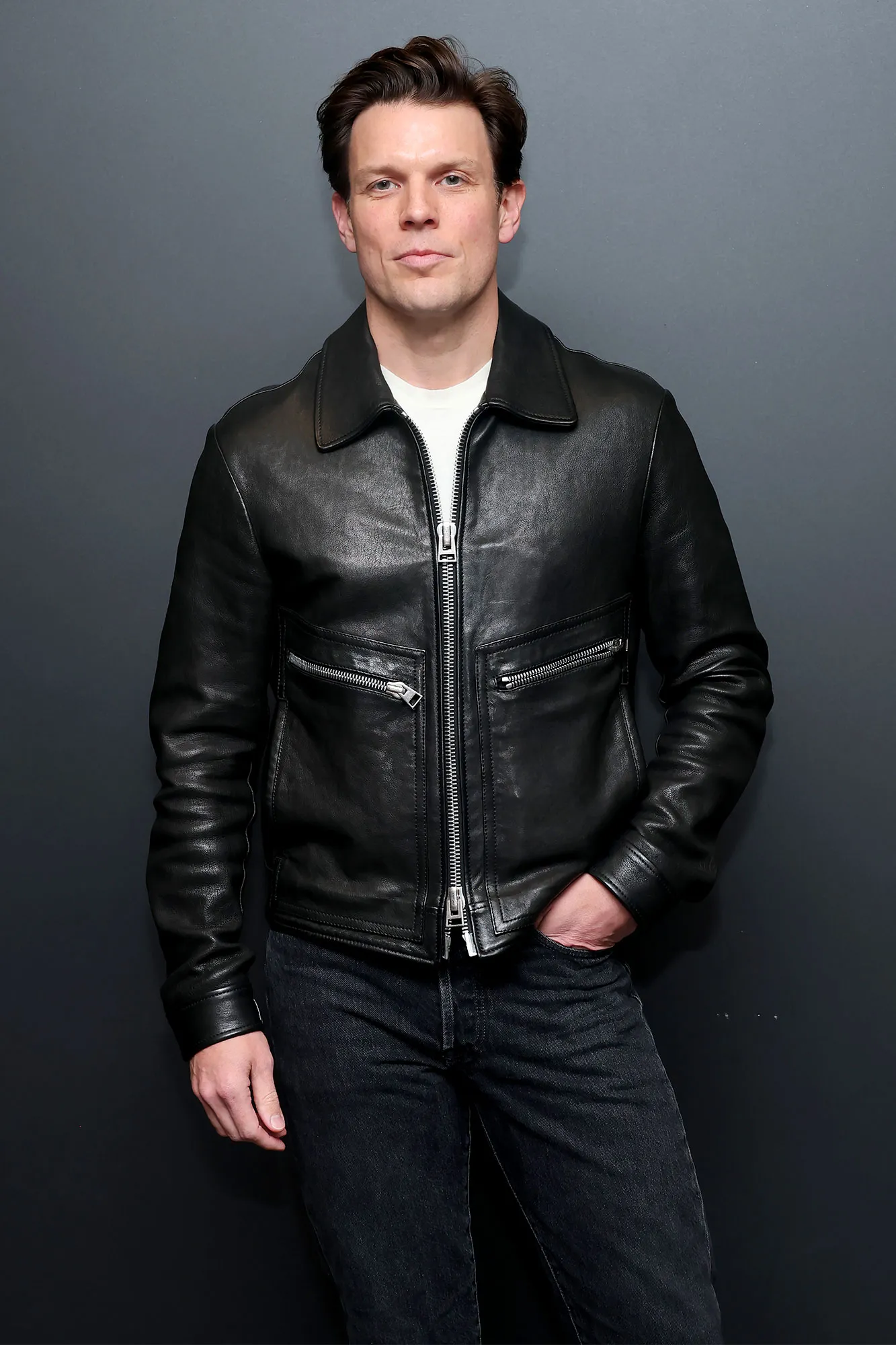 Jake Lacy attending an event and posing for photographs