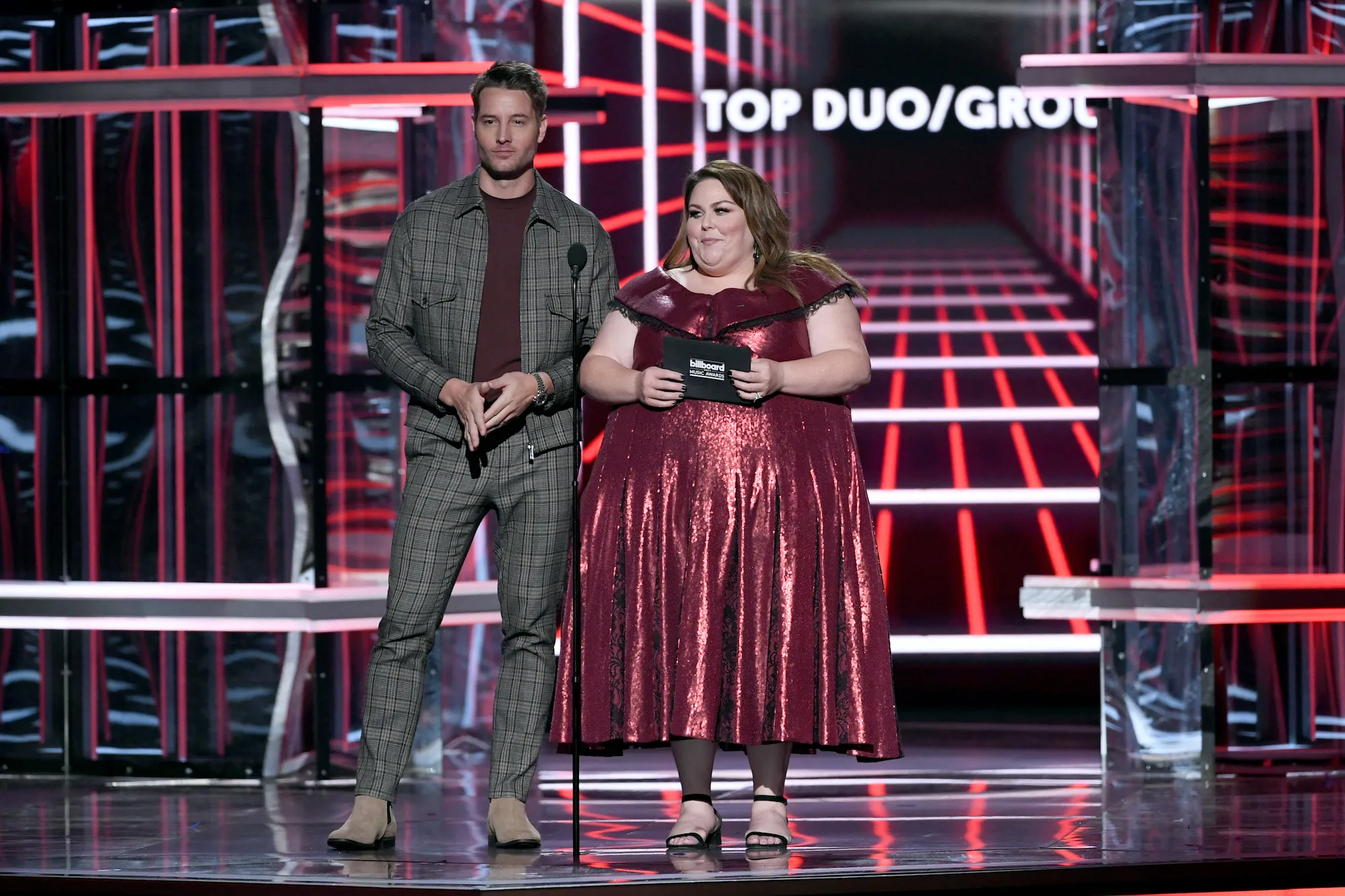 Justin Hartley and Chrissy Metz posing together at an event