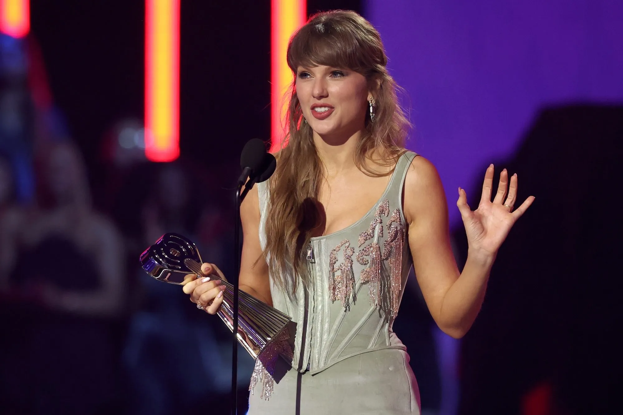 Taylor Swift performing on stage during a concert