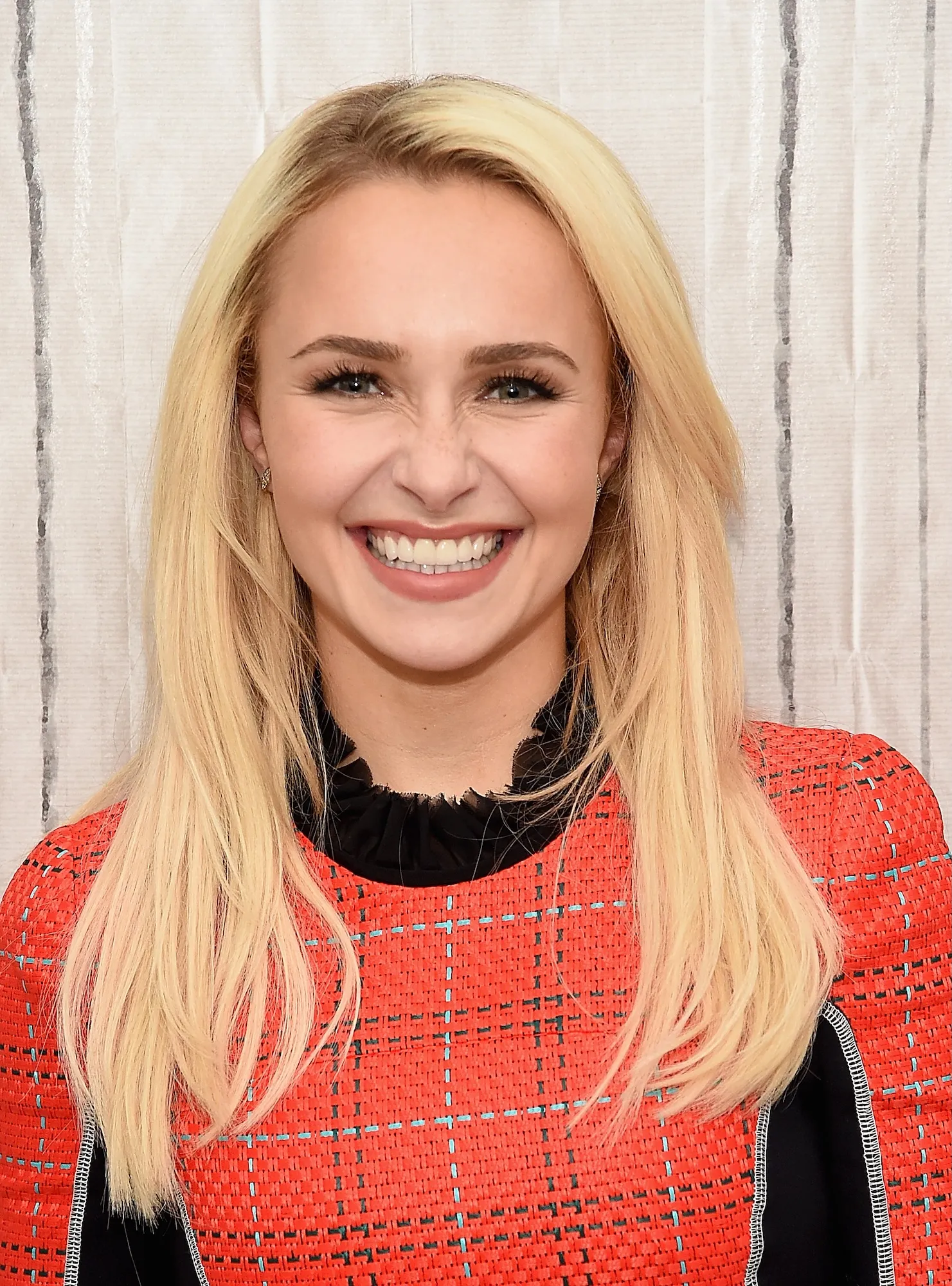 Hayden Panettiere posing on a red carpet at a Hollywood event