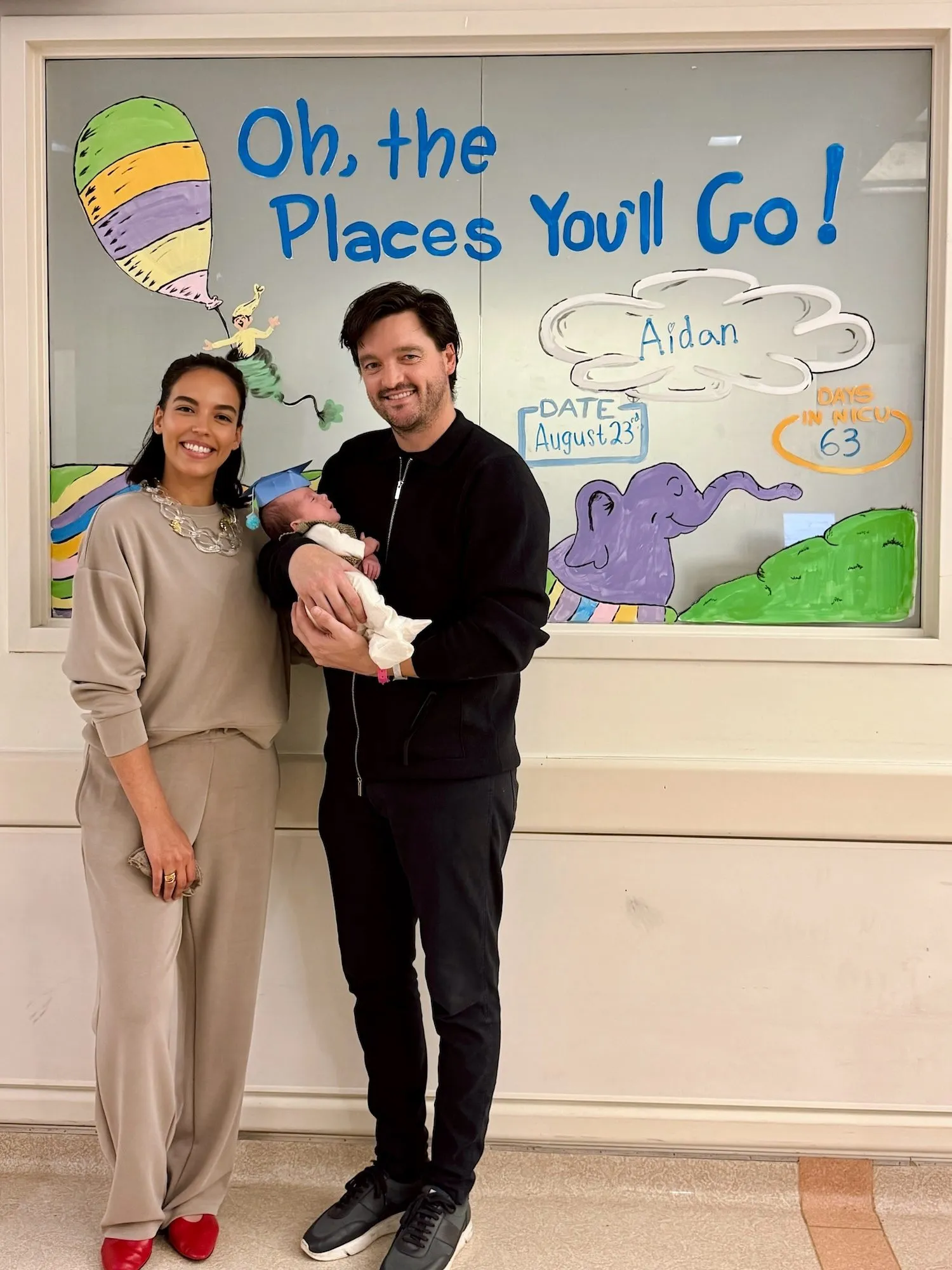 Danielle Olivera and partner Eoin Heavey holding newborn son Aidan after leaving the NICU